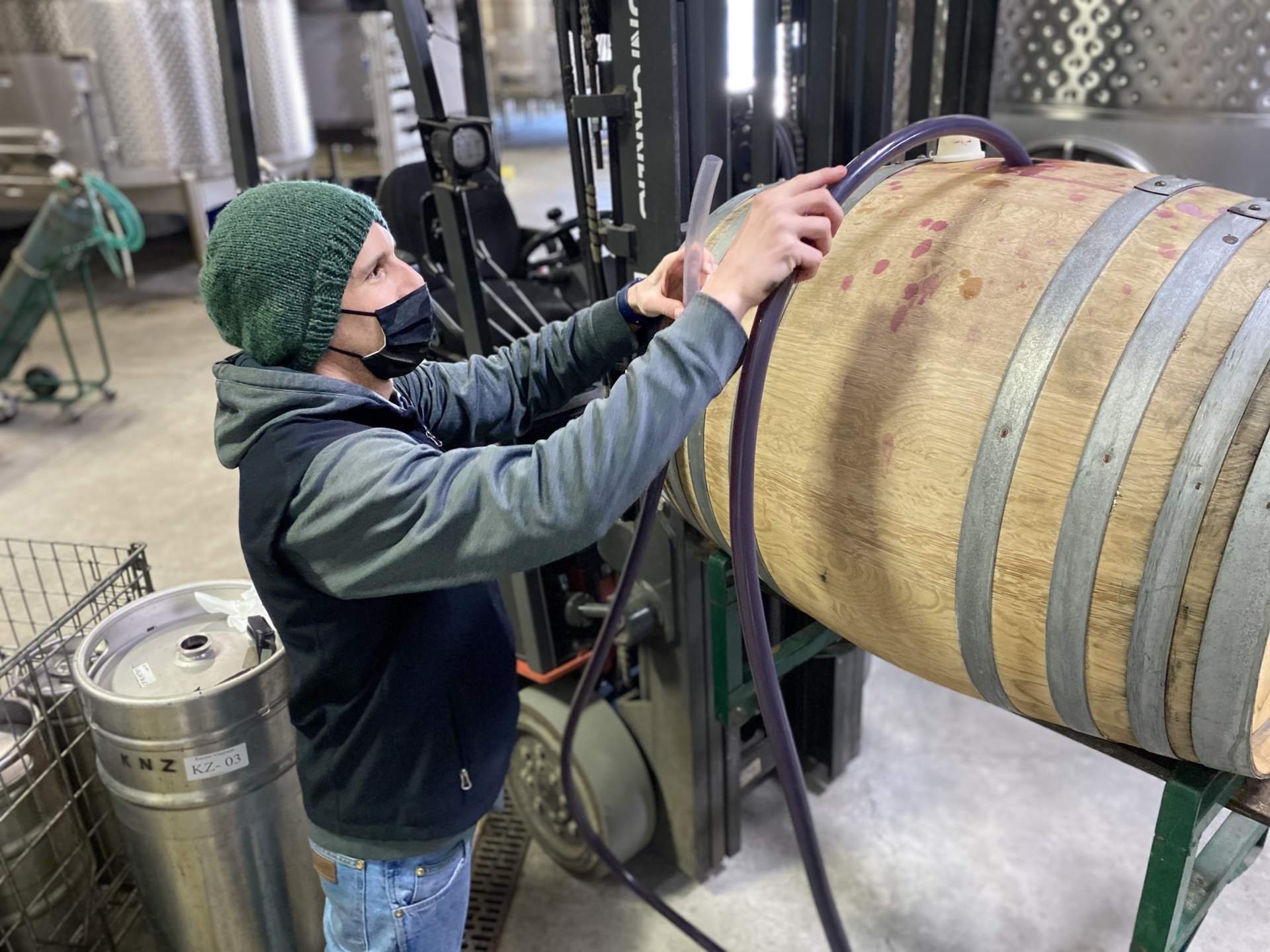 Alex Kanzler in the Cellar with a barrel